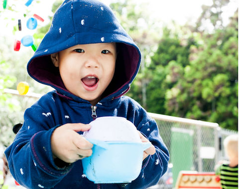 Little boy with a teapot..